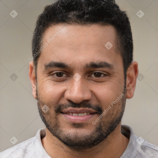 Joyful white young-adult male with short  black hair and brown eyes