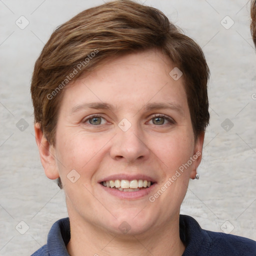 Joyful white young-adult female with short  brown hair and blue eyes