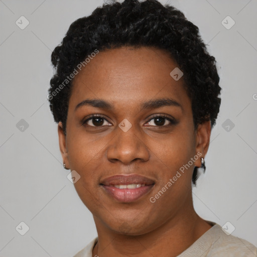 Joyful black young-adult female with short  black hair and brown eyes