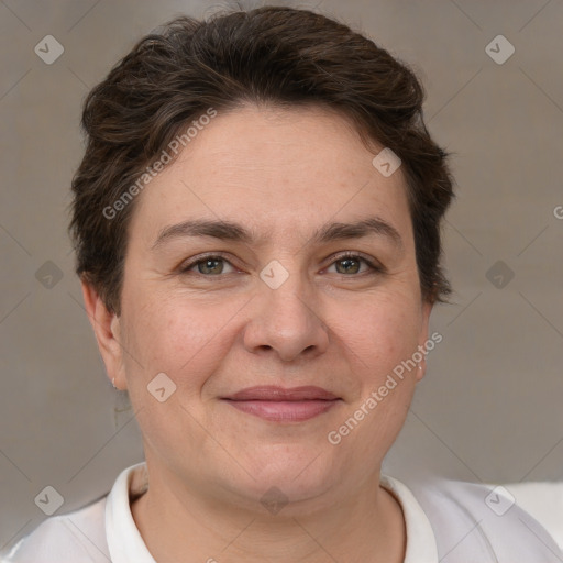 Joyful white adult female with short  brown hair and brown eyes