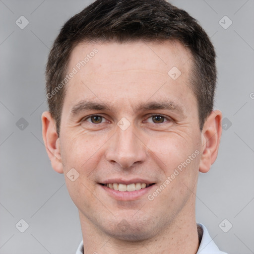 Joyful white adult male with short  brown hair and brown eyes