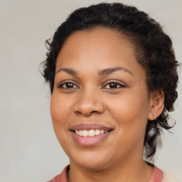 Joyful latino young-adult female with medium  brown hair and brown eyes