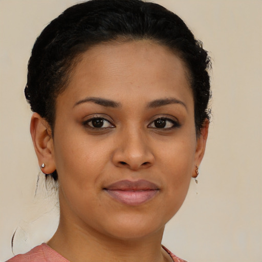 Joyful black young-adult female with short  brown hair and brown eyes