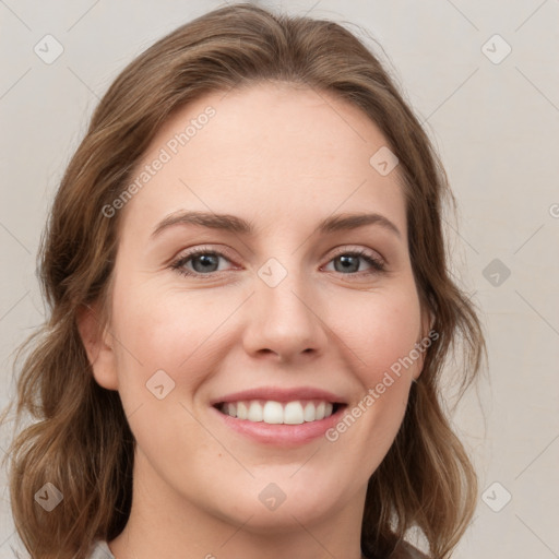 Joyful white young-adult female with medium  brown hair and green eyes