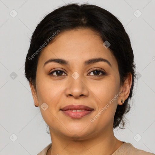 Joyful latino young-adult female with medium  brown hair and brown eyes