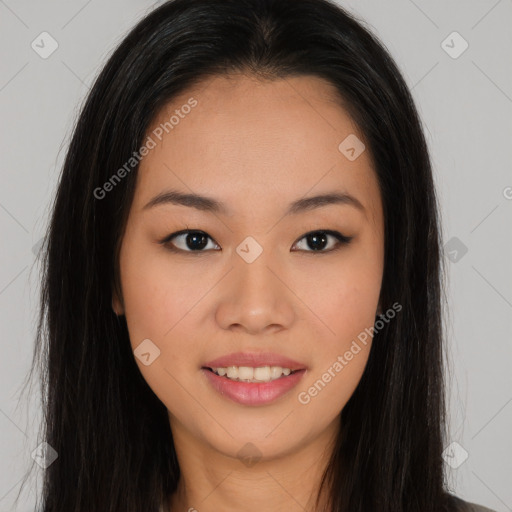 Joyful asian young-adult female with long  brown hair and brown eyes