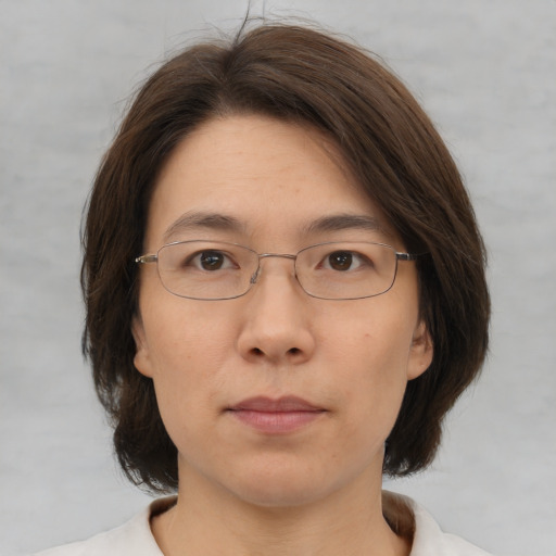 Neutral white adult female with medium  brown hair and brown eyes