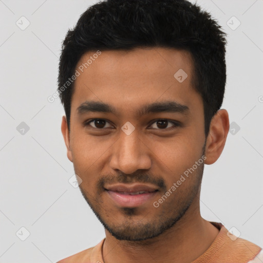 Joyful latino young-adult male with short  black hair and brown eyes
