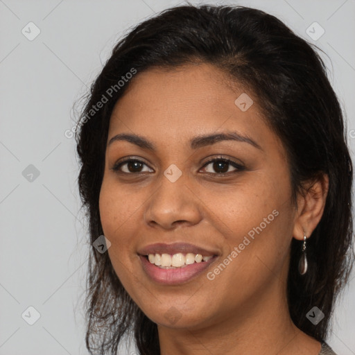 Joyful latino young-adult female with medium  brown hair and brown eyes