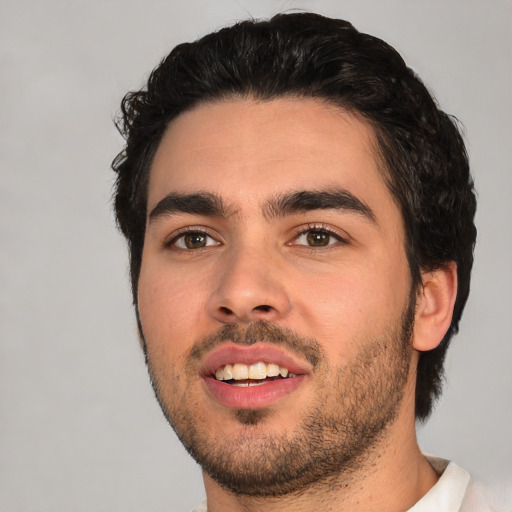 Joyful white young-adult male with short  black hair and brown eyes