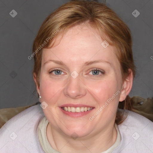 Joyful white adult female with medium  brown hair and blue eyes