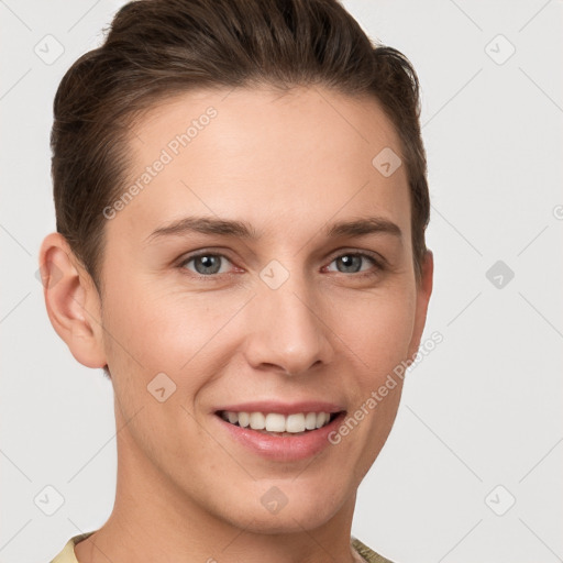 Joyful white young-adult female with short  brown hair and grey eyes