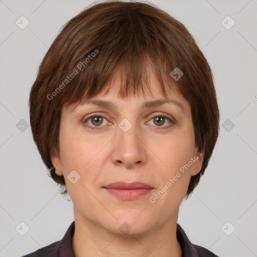 Joyful white adult female with medium  brown hair and grey eyes