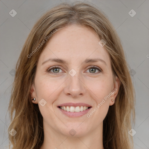 Joyful white young-adult female with medium  brown hair and green eyes