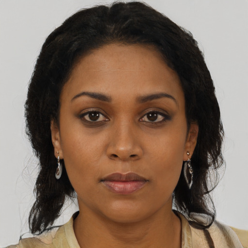 Neutral black young-adult female with long  brown hair and brown eyes