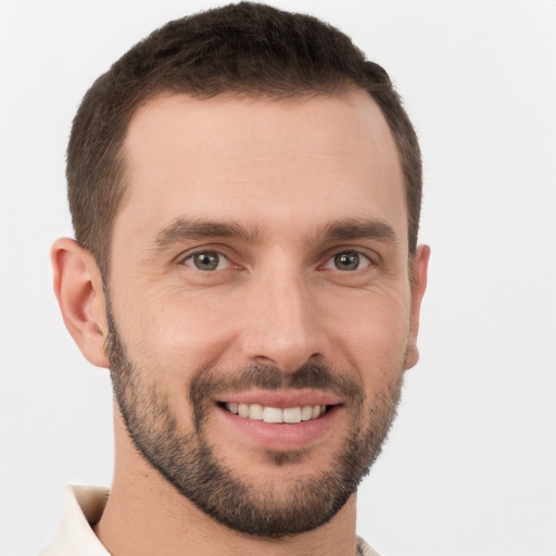 Joyful white young-adult male with short  brown hair and brown eyes