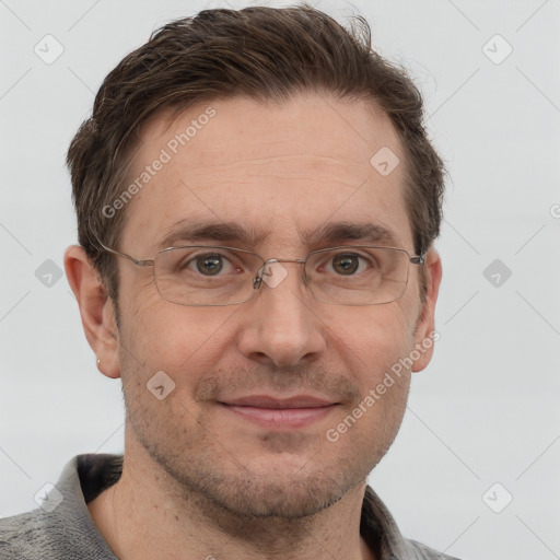 Joyful white adult male with short  brown hair and grey eyes