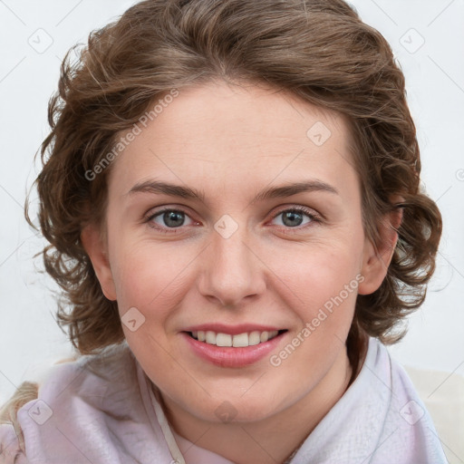 Joyful white young-adult female with medium  brown hair and blue eyes