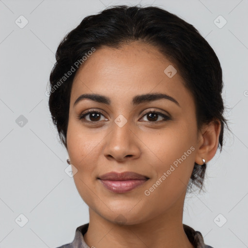 Joyful latino young-adult female with medium  black hair and brown eyes