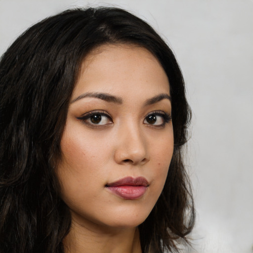 Neutral latino young-adult female with long  brown hair and brown eyes