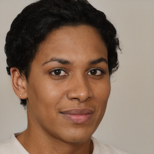 Joyful black young-adult female with short  brown hair and brown eyes