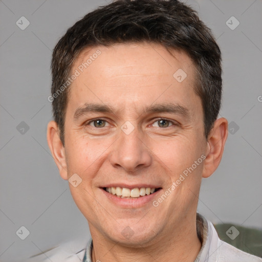 Joyful white adult male with short  brown hair and brown eyes