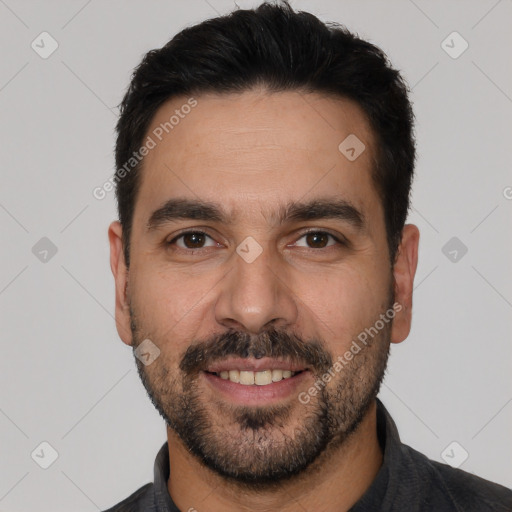 Joyful white young-adult male with short  black hair and brown eyes