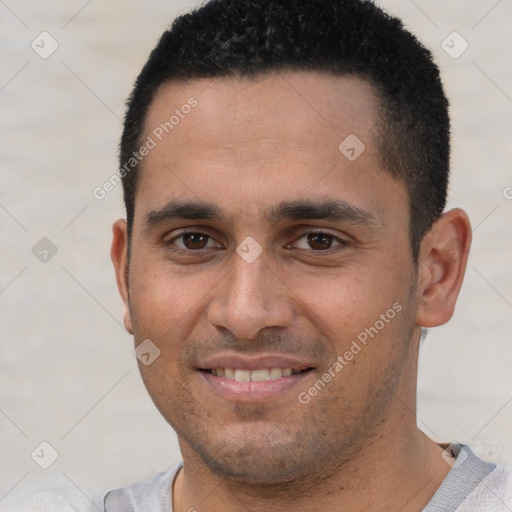 Joyful white young-adult male with short  black hair and brown eyes