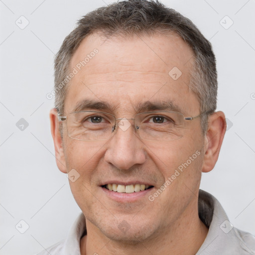 Joyful white middle-aged male with short  brown hair and brown eyes