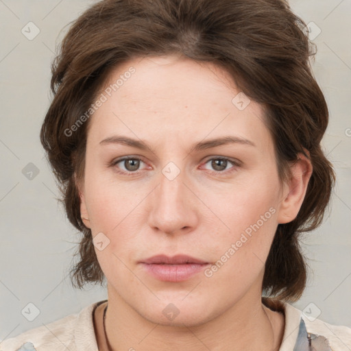 Neutral white young-adult female with medium  brown hair and grey eyes