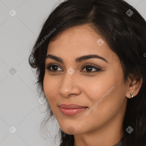 Joyful latino young-adult female with long  brown hair and brown eyes