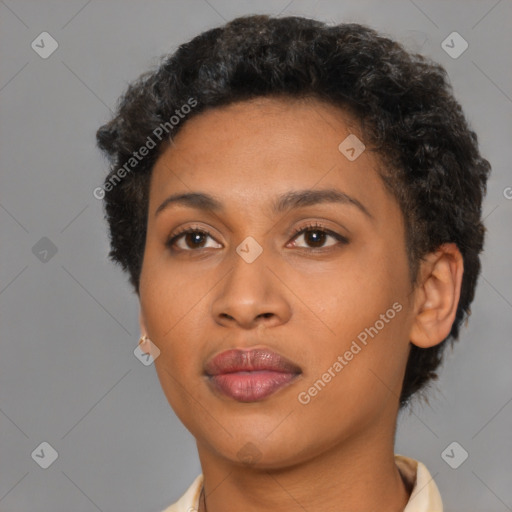 Joyful black young-adult female with short  brown hair and brown eyes