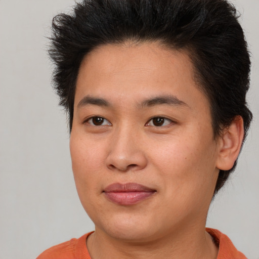 Joyful asian young-adult female with short  brown hair and brown eyes