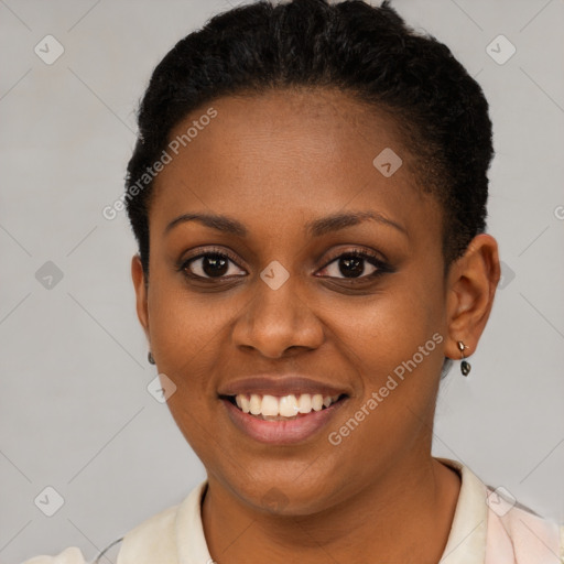 Joyful black young-adult female with short  black hair and brown eyes