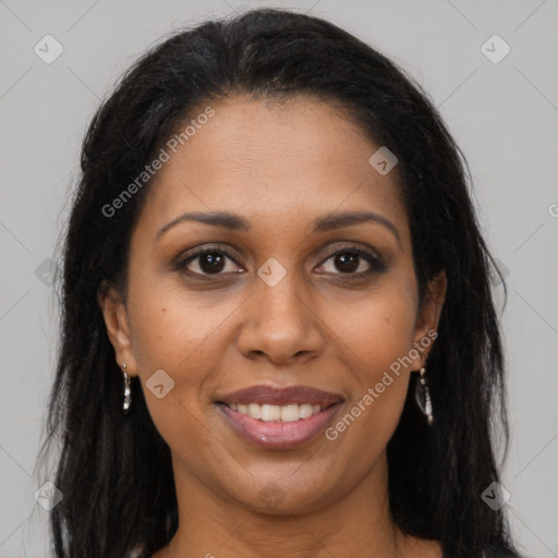 Joyful black young-adult female with long  brown hair and brown eyes