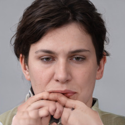 Neutral white adult female with medium  brown hair and brown eyes