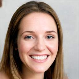 Joyful white young-adult female with long  brown hair and blue eyes