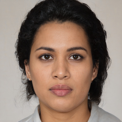 Neutral latino young-adult female with medium  black hair and brown eyes