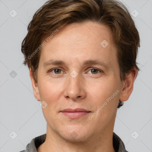 Joyful white adult male with short  brown hair and grey eyes