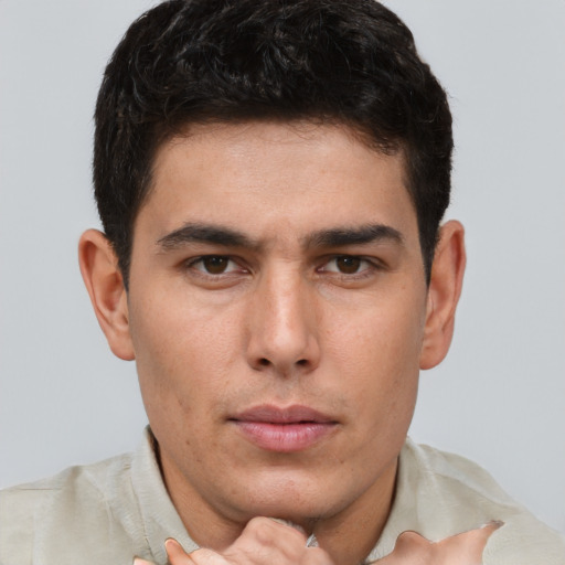 Neutral white young-adult male with short  brown hair and brown eyes