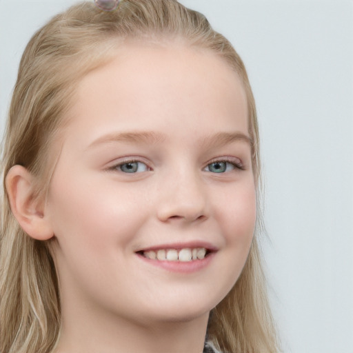 Joyful white child female with long  brown hair and blue eyes