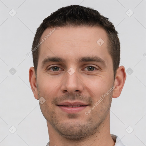 Joyful white young-adult male with short  brown hair and brown eyes