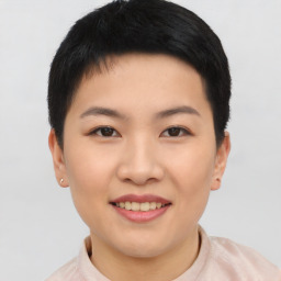 Joyful asian young-adult female with short  black hair and brown eyes