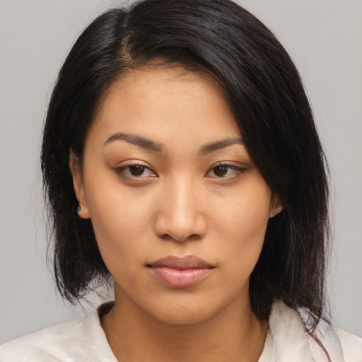 Neutral asian young-adult female with medium  black hair and brown eyes