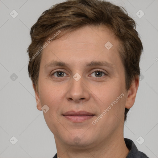 Joyful white adult male with short  brown hair and grey eyes