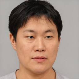 Neutral asian young-adult male with short  brown hair and brown eyes