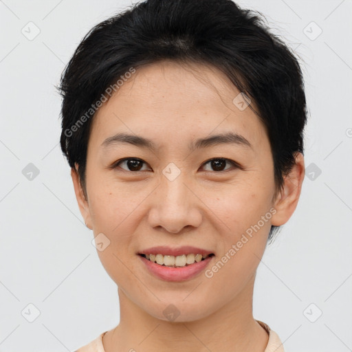 Joyful asian young-adult female with short  brown hair and brown eyes