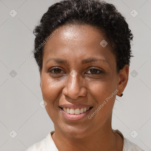 Joyful black adult female with short  brown hair and brown eyes