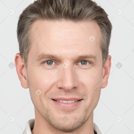 Joyful white adult male with short  brown hair and grey eyes