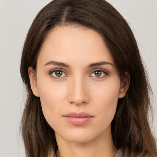 Neutral white young-adult female with long  brown hair and brown eyes